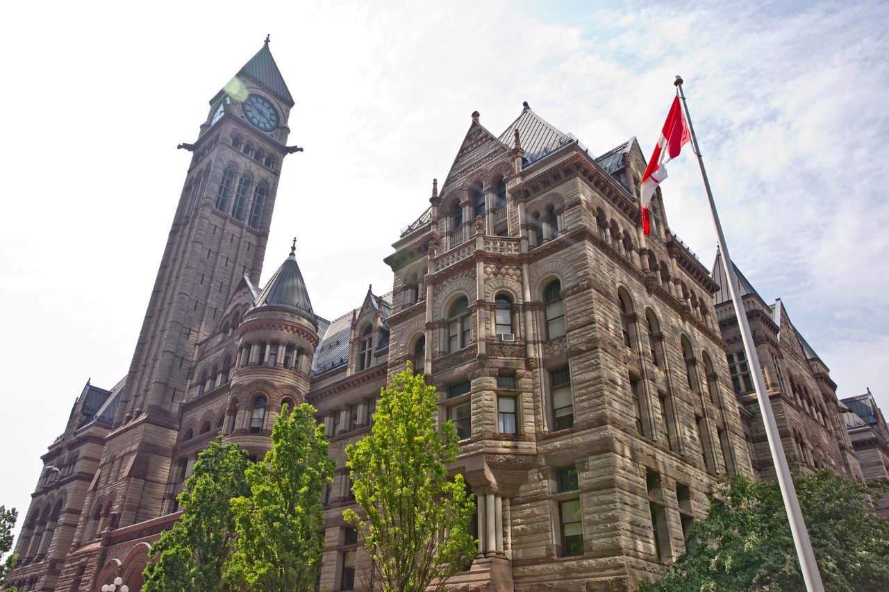 A large stone building with a clock tower.