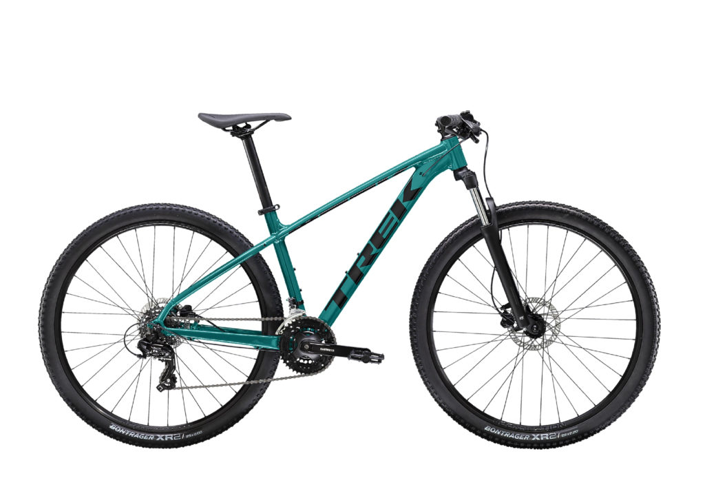 A green mountain bike with a sturdy frame, front suspension, and thick off-road tires. It has a black seat, handlebars, and disk brakes.
